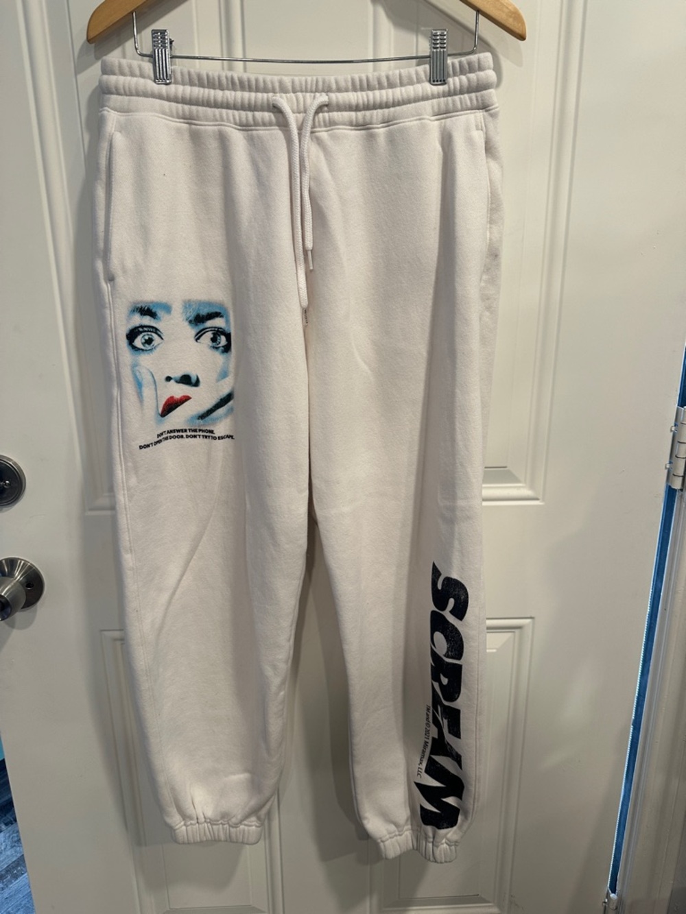 Men’s Hollister scream Ghostface cream colored sweatpants